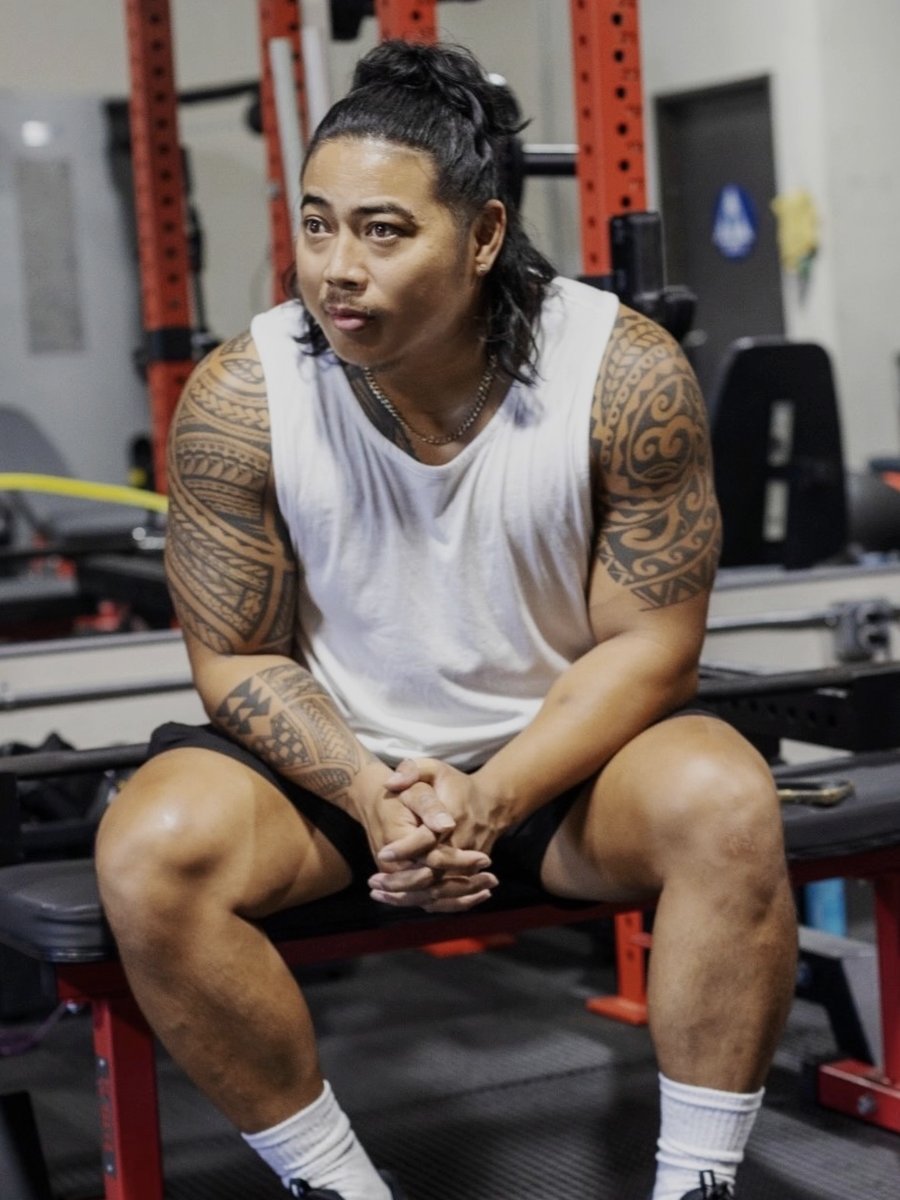 Mako Alhambra, boxing and Muay Thai specialist at LionStrong Athletics, seated on a bench